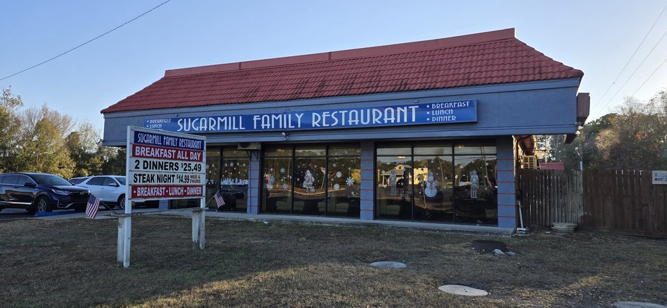 Front view of a family restaurant along the road.