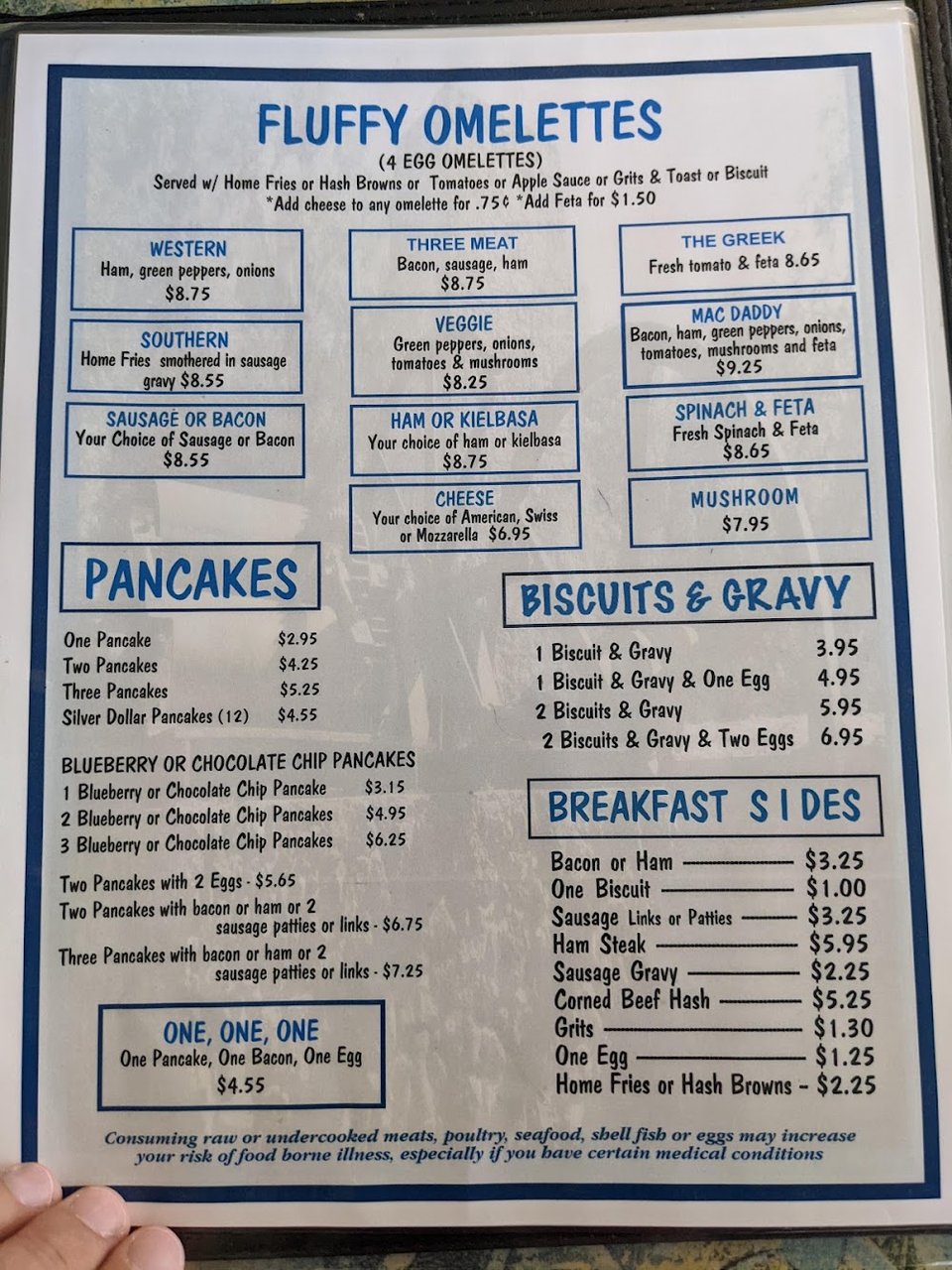 Menu page with eggs, sandwiches, and specials.